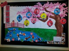 a bulletin board with chinese lanterns and flowers