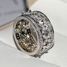 a close up of a ring with diamonds on it