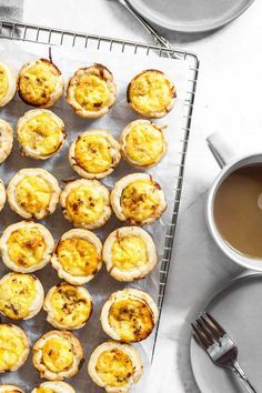 mini quiches on a cooling rack next to a cup of coffee