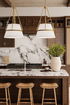 A Pair of Oliver Pendants are installed in Aged Gold over a kitchen island with warm earth tones. Modern Pendant Lighting Kitchen Island, Alora Lighting, Lights Over Island, Lights Over Kitchen Island, Large Pendant Lighting, Island Pendant Lights, Kitchen Island Lighting Pendant, Island Pendants, Cozy Ambiance