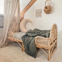 a wicker day bed with a blanket on it