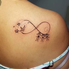 the back of a woman's shoulder with an infinite symbol and two small children holding hands