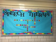 a bulletin board with words written on it in front of a wall that says speech therapy