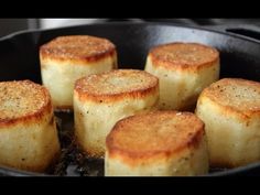 some food is cooking in a pan on the stove and it looks like they are fried