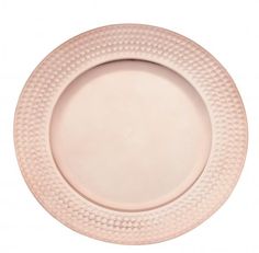 a pink plate with white dots on the rim is shown in front of a white background