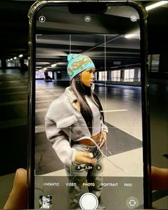 a person taking a selfie with an iphone