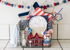 a basket filled with patriotic items on top of a tiled floor