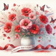 a vase filled with lots of red flowers on top of a white table next to a ribbon