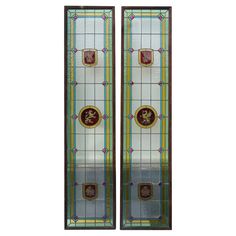 two stained glass doors with gold and red designs on the front, side and back panels