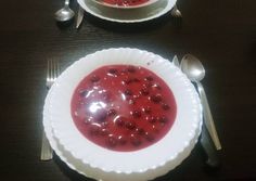 two plates with food and silverware on a table