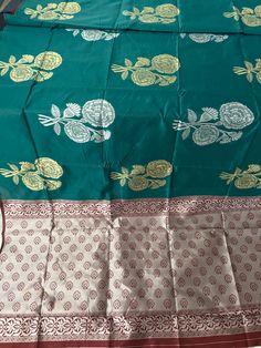 Soft Silk  Saree/Light Dark Leaf Green Color Saree/Floral Design Butta Saree/ Border Less Saree / Light weight/South Indian Saree DETAILS:  Includes One Saree with Blouse pice  Fall: not included Saree Edges: unfinished Material Excluding Design: Soft  silk Saree  Saree weight: 1.166lb (529 g) Saree Dimensions: 218 inches (5.5 meters) long. 47 inches (1.2 meters)  Blouse Piece Attached   Saree color: Green  Pallu color: Pink Maroon  Border color: No Border  Blouse piece color: Maroon Color PRODU Green Block Print Dupatta For Festivals, Green Bollywood Traditional Wear With Block Print, Block Print Choli For Puja And Diwali, Green Bollywood Style Traditional Wear With Block Print, Diwali Choli With Block Print For Puja, Diwali Puja Choli With Block Print, Semi-stitched Green Block Print Traditional Wear, Block Print Blouse Piece For Puja And Diwali, Green Block Print Traditional Wear For Diwali