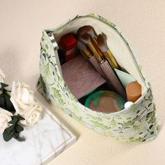 an open makeup bag sitting on top of a table