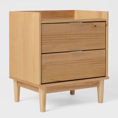 a wooden cabinet with two drawers on one side and an open drawer on the other