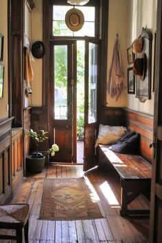 the sun shines through an open door into a room with wooden floors and benches