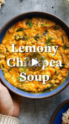 someone holding a bowl of soup with the words lemony chick pea soup in it