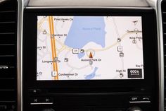 a car dashboard with the navigation system on it