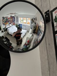 a man is taking a selfie in the mirror