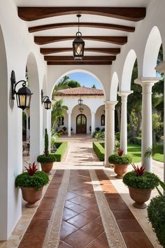 an outdoor walkway with potted plants on either side