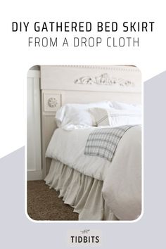 a white bed sitting next to a window with the words diy gathered bed skirt from a drop cloth