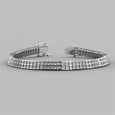 Give the ideal gift to your special someone with this refined bracelet. A double row of channel set princess cut Simulated Diamonds with a total weight of 24.6 Ctw shine brilliantly as they cascade down your wrist. Enclosed by a box clasp to ensure your precious piece is always secure. Chose the perfect token of your love today.   24.6 Ctw Princess Cut Double Tier Tennis Bracelet;  Stone Clarity:VVS-1;  Available in:14K White or Yellow Gold;  length: 7 inches;  Model: B2885A; Tiffany Style Engagement Ring, Diamond Princess, Bracelet Stone, Wrist Wear, Box Clasp, Tiffany Style, Princess Diamond, Channel Set, Matching Band