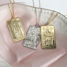 Thanks to the special technique that we use, our pendants have the most detailed and fine engravings of their kind. The tarot pendant is a powerful symbolic gift for your loved ones and can also be worn as a layer necklace. The pendant is made of 925k sterling silver using traditional silversmithing techniques and tools. Item details: Pendant dimensions:1.14 inchx 0.62 inch (2.9cm x 1.6cm) 925K STERLING SILVER The Empress Tarot Card Necklace Description: The Empress is a rich card that illustrat Tarot Pendant, The Empress Tarot, Personalized Silver Jewelry, Tarot Necklace, Mystic Arts, Love Tarot Card, Tarot Card Necklace, Empress Tarot Card, Tarot Card Tattoo