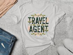 "Travel Agent Shirt. Travel Agent Tee. Travel Gift. Travel Lover Tee. Adventure Shirt. Agent T-shirt. Travel Pro Tee. Travel Guru Shirt Customers love the relaxed, tailored and ultra-comfortable style of our custom printed t-shirts. Please refer to the material details and the sizing chart below to find your perfect fit. == Shipping and Processing time == Production time: 1-4 business days U.S. Shipping time: 3-4 business days. == International Orders == Shipping times for international orders v Graphic Tee With Letter Print For Travel, First Youtube Video Ideas, Adventure Shirt, Comfortable Style, Video Ideas, Printed T Shirts, Travel Lover, Travel Agent, Heather Black