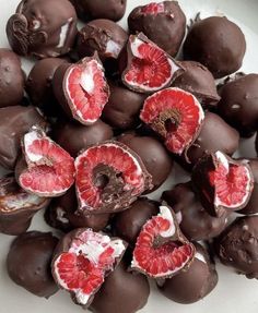 a plate full of chocolate covered blood oranges