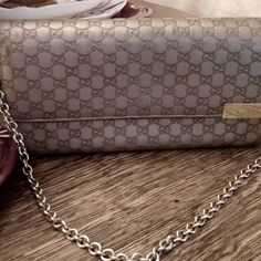 Gucci Micro Guccissma Chain Leather Clutch Metallic Beige Wallet. Length 8in Width 1.25in Height 4.5 Chain Is Included. Can Be Detached And A Crossbody Chain Added. Previously Owned There Is Nature Wear. Look At Pictures Closely. This Is Still A Very Nice Bag. Lots Of Storage And Card Slots Chain Is Removable. Smoke And Pet Free Home Bags Gucci, Wallet On Chain, Leather Chain, Leather Clutch, Fun Bags, Gucci Bag, Leather Wallet, Card Slots, Slots