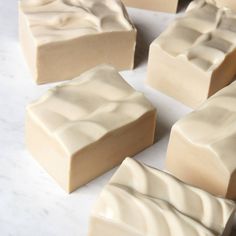 several pieces of white chocolate sitting on top of a counter