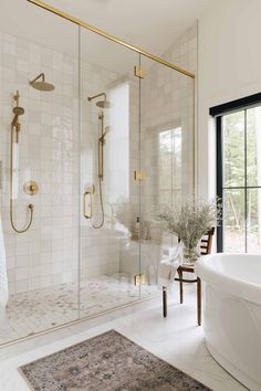 a bathroom with a tub, shower and toilet