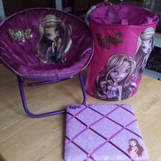 two children's chairs, one pink and one purple with barbie dolls on them