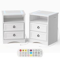 two white nightstands next to each other with remote controls on the bottom and side