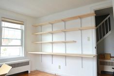 an empty room with some shelves in it