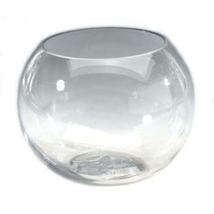 a clear glass vase sitting on top of a white table