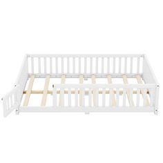 a white bed frame with wooden slats on the top and bottom rails in front