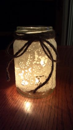 a mason jar with string lights in it