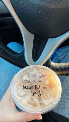 someone is holding a plastic cup with the words hope you may be as beautiful as you