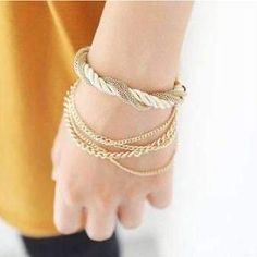 Luxurious and stylish! This bracelet features a silky soft ivory colored twisted rope, intertwined with 6 varying style gold chains. The lobster claw clasp with adjustable link chain is ideal for easy wear and sizing. Casual, yet high fashion and sophisticated. Material: Gold plated alloy (Nickel Free) Size: One size fits most (maximum size 9) Comes in a gift box (Reg $42.95) Handmade Bangle Bracelets, Gold Layered Bracelets, Chain Braid, Amazon Jewelry, Forever Gifts, Woven Chain, Girls Handmade, Braided Rope, Elegant Bracelet