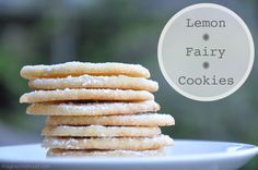 a stack of lemon fairy cookies sitting on top of a white plate