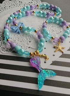 "Mermaid inspired necklace bracelet set, kids beaded set, jewelry set, childrens jewelry, starfish bracelet, kids necklace, party favor. \"Mermaid Kisses and Starfish Wishes\" DETAILS and MEASUREMENT: Necklace: 20\" Bracelet: 6.5\" Made on stretchy cord. We can also put a clasp on it, for an extra $3.50 PLEASE NOTE: due to the high volume of orders, it is impossible for us to keep the same beads for all our orders, so the beads on your order may differ from the ones shown in the photo. if you wo Mermaid Bracelet Diy, Little Mermaid Bracelet, Big Sister Necklace, Blue Snacks, Festival Clothes, Mermaid Crafts, Mermaid Kisses, Mermaid Bracelet, Starfish Bracelet