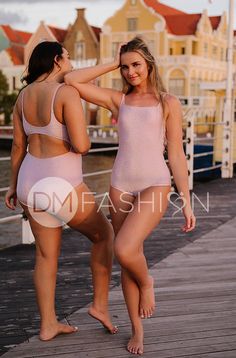 A NEW DM Swim design for 2023 that includes our signature details, such as open back, full bottom coverage, full bra support, & a modest square neckline! Perfect one piece for short & long torsos! This silhouette is flirty, fun & modest! So comfortable you will want to live in it all summer! Product Fit & Details: Square neckline Fully lined Our signature full bra support AA-DD cup sizes Support straps Comfortable fit Open back Full bottom coverage Exclusive shimmer fabric that does not itch Fab Pink Fitted Swimwear With Low Back, Fitted Pink Swimwear With Low Back, Fitted Low Back Pink Swimwear, Fitted Swimwear With Built-in Bra And Scoop Neck, T-back Swimming Bodysuit With Built-in Bra, Fitted Bra-friendly Swimwear With Square Neck, Square Neck Swimwear With Built-in Bra, Bra-friendly Fitted Square Neck Swimwear, Poolside Cross Back Swimwear With Built-in Bra