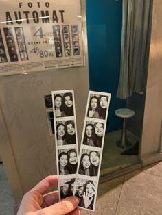 a person holding up four photos in front of an elevator