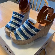 New In Box And Never Worn Marc Fisher Adria Sandal In Washed Denim Size 8. Retro Style Meets Nautical Chic With A Striped Vamp And Soft Leather On Top Of An Espadrille High Heel Wedge And Platform. Runs Large; Order Next Size Down. M=Medium Width - Peep Toe - Striped Applique Vamp - Ankle Buckle Strap Closure - Lightly Padded Insole - Leather Heel Counter - Espadrille Platform And Wedge Heel - Approx. 3.75" Heel, 1.75" Platform - Imported Materials Textile And Leather Upper, Manmade Sole Closed Toe Canvas Sandals For Beach, Casual Canvas Wedge Sandals For Vacation, White Canvas Sandals For Summer, Casual White Canvas Sandals, Denim Open Toe Wedge Sandals For Beach, Denim Open Toe Wedge Sandals For Vacation, Beach Denim Open Toe Wedge Sandals, Denim Wedge Sandals For Summer Vacation, Summer Vacation Denim Wedge Sandals