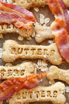 bacon and cheese dog treats with the word bones spelled out in english letters on them