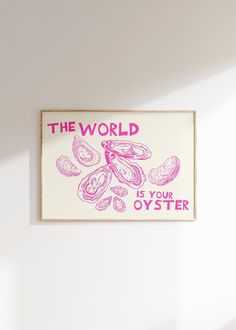 the world is your oyster poster hangs on the wall in front of a white wall