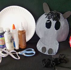 paper plates and craft supplies are sitting on a table