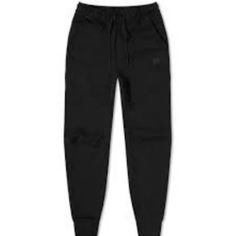 Upgrade Your Wardrobe With These Nike Tech Fleece Joggers In Black From The 3rd Season Collection, Size Xl. Crafted From Nike’s Lightweight Tech Fleece Fabric, These Joggers Provide Warmth Without Extra Bulk. The Tapered Fit Ensures A Sleek Look, While The Elastic Waistband With Drawstring Offers An Adjustable, Comfortable Fit. Features Include Zippered Side Pocket For Secure Storage And Cuffed Ankles For A Clean Finish. Condition: Good Condition, No Visible Rips Or Tears. Size: Xl (Fits True To Nike Tech Pants, Black Nike Tech, Nike Tech Fleece Joggers, Tech Pants, Pants Nike, Nike Tech Fleece, Nike Tech, Tech Fleece, Fleece Joggers