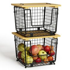 two metal baskets filled with fruit on top of each other