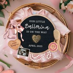 a basket filled with lots of different items on top of a pink table next to flowers