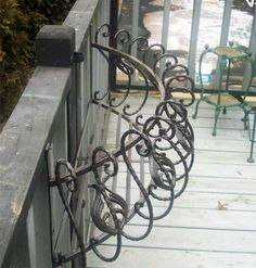 wrought iron railings and chairs on a deck